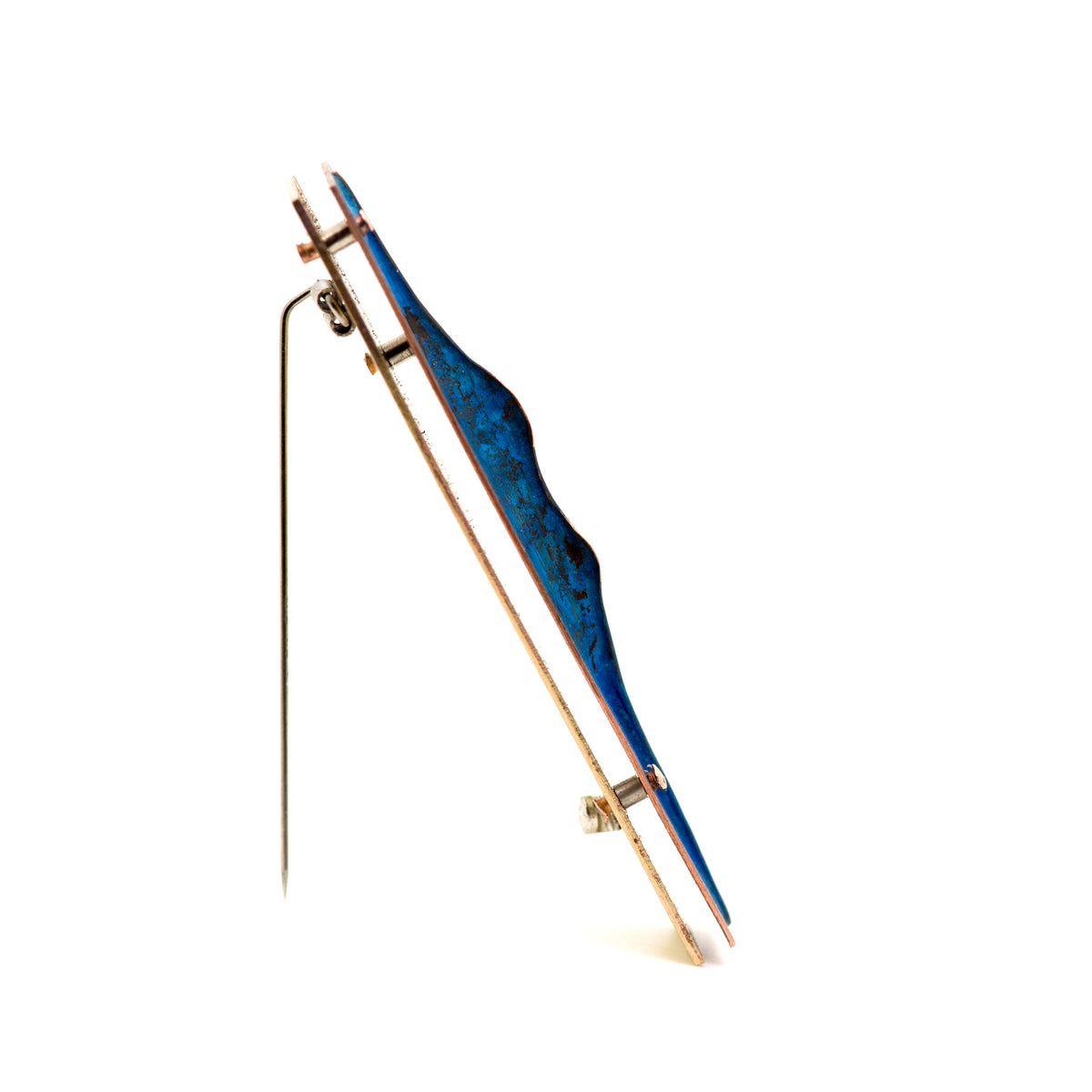 Side profile of dimensional fold-formed copper brooch