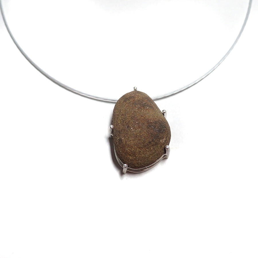 Handcrafted silver necklace pendant by MorphiArtForge, featuring a beach pebble from Beach Bounty Creations.